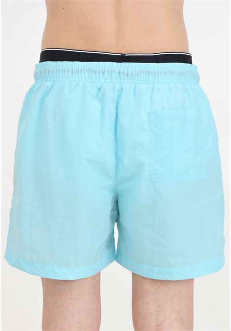 Turquoise men's swim shorts with logo patch and elasticated slip model CALVIN KLEIN | KM0KM00981CSY